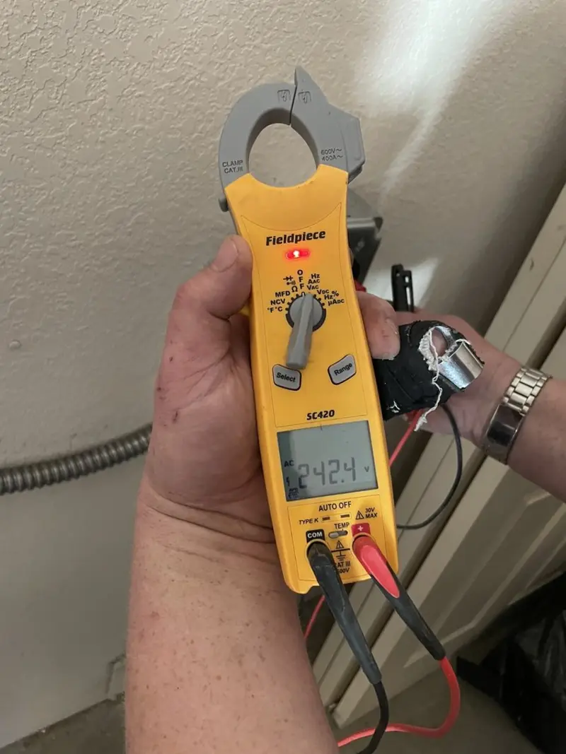 Voltage testing with clamp meter during Electrical Installation Services in Bedford